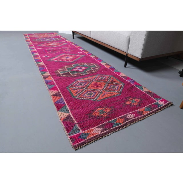 Vintage Turkish Hand-Knotted vintage rug is a semi-Vintage runner rug.'70s Eastern region of Turkey's unique rug is...