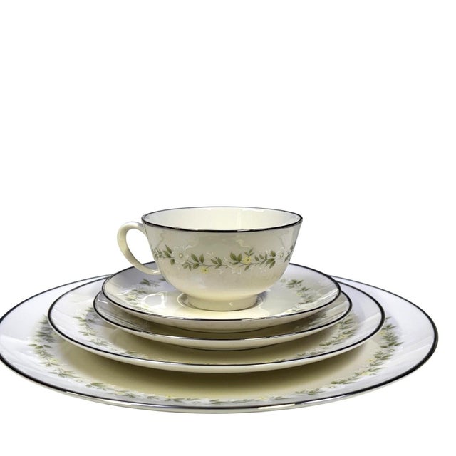 A truly magnificent and comprehensive Noritake Ivory China dinnerware set, featuring the elegant 'Cornelia' pattern. This...