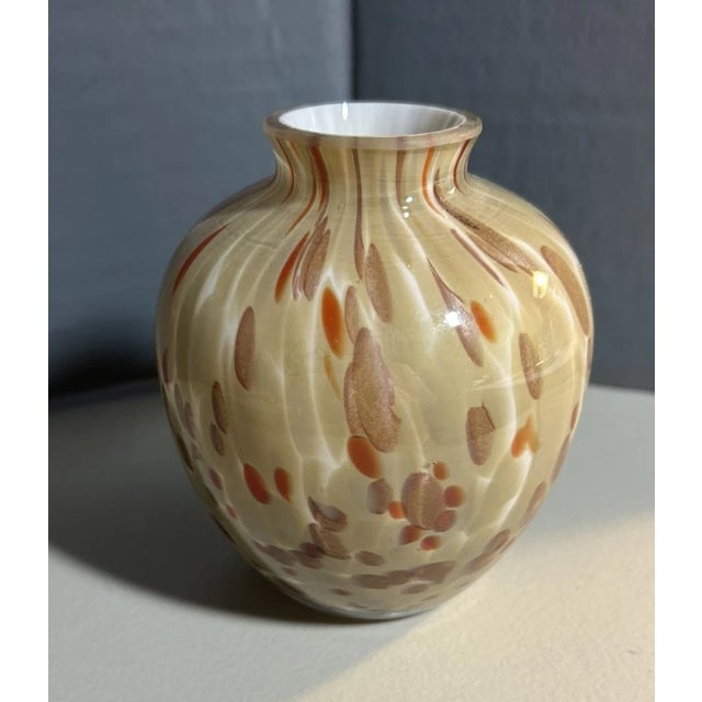 Add a touch of Italian artistry to your collection with this Vintage Murano Mid-Century “Copper Fleck” Art Glass Vase....