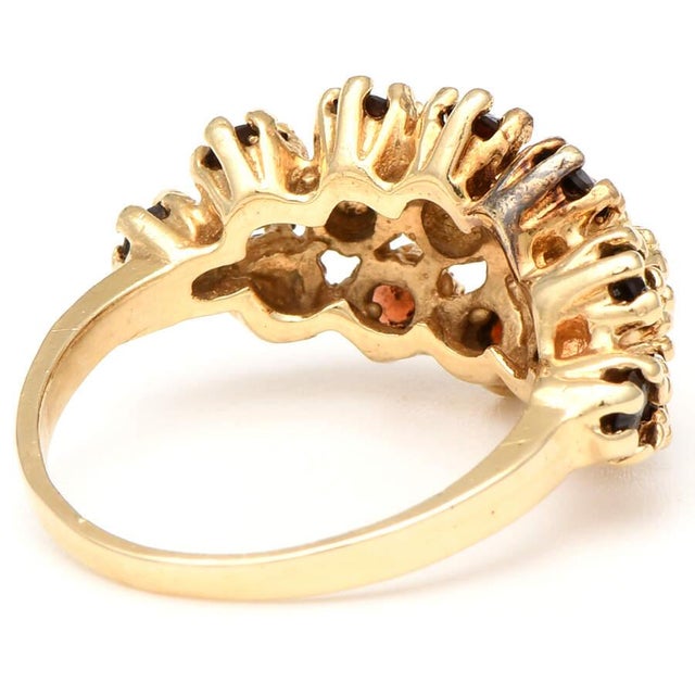 This vintage-style ring features an exquisite combination of garnet and yellow gold. The combination goes beautifully with...