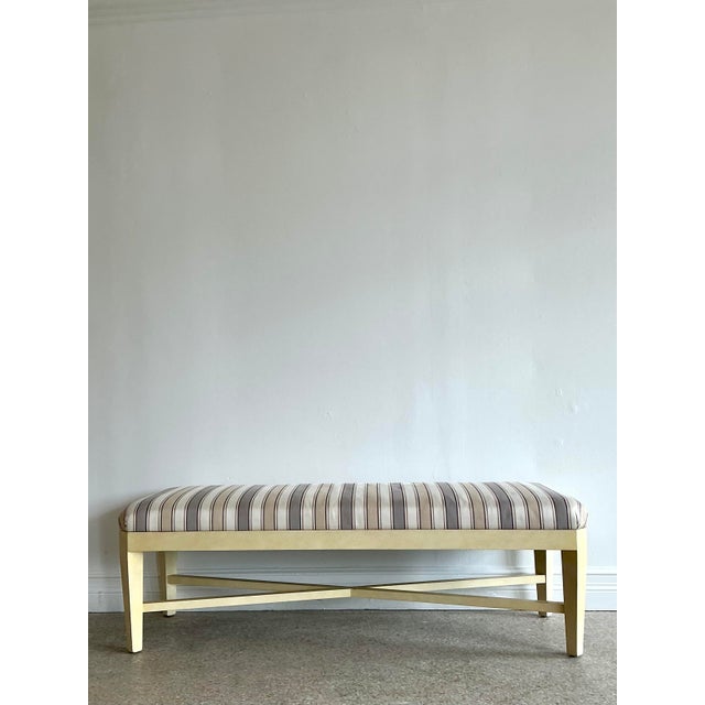 This sophisticated transitional bench is a study in understated elegance and architectural rhythm. The frame is finished...