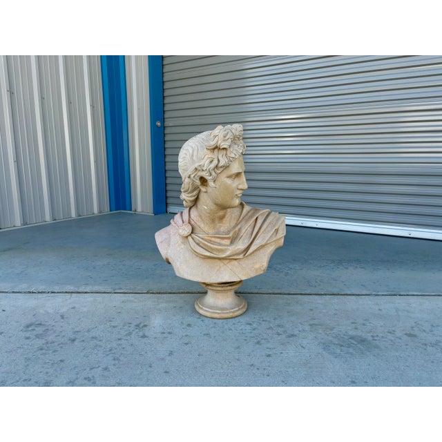 Vintage marble bust of Apollo designed and manufactured in Italy circa the 19th century. The stunning marble frame...