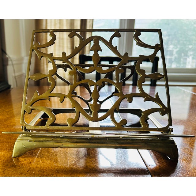 Vintage brass book stand with elaborate scrolling metalwork and a wonderfully weighty presence. Both sturdy and...