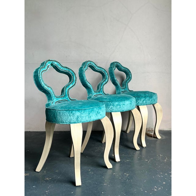 Unveil a trio of spectacular Vintage Regency Keyhole Barstools, destined to become the focal point of any sophisticated...