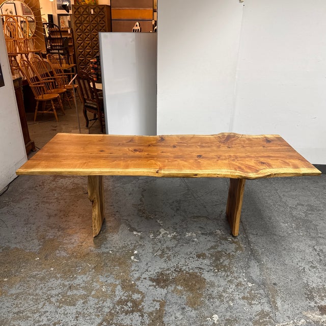 Design Plus Gallery presents a Contemporary Live Edge Dining Table. The expansive tabletop showcases the natural grain...