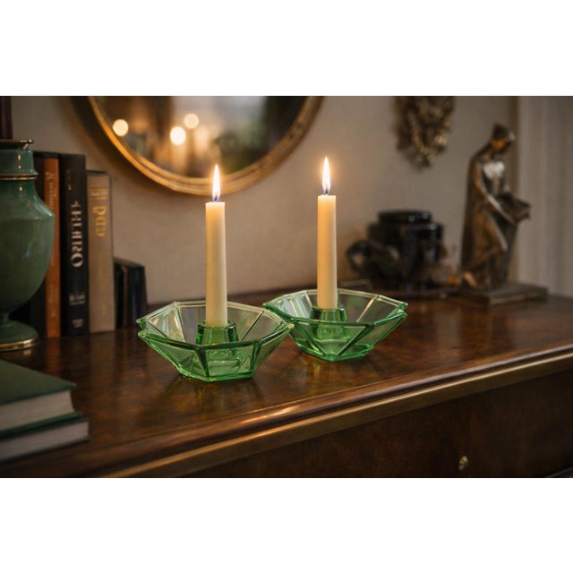 Striking pair of vintage uranium glass candlesticks featuring a bold geometric design with an octagonal upper form and a...