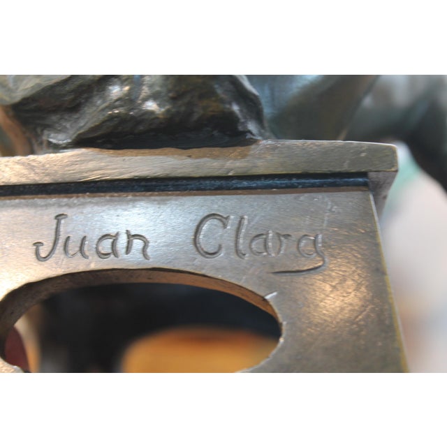 By renowned artist and sculpture Juan Clara, this delightful casting depicts a young girl sat upon a stool, struggling to...