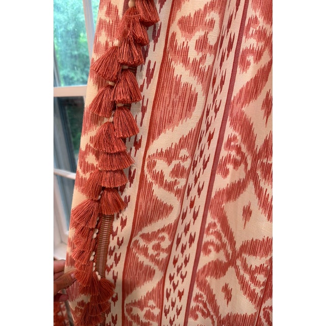 Pair of stunning custom drapery panels in Cowtan & Tout's Rapallo in coral with Samuel & Sons cabana tassel fringe in...