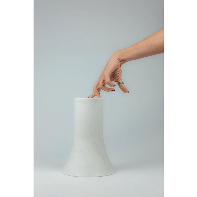 Three cylindrical music boxes gradually open upward, like resonant cavities carved in marble, transforming the gesture of...