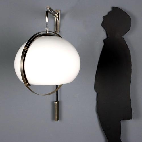Vintage Space Age wall lamp with a white methacrylate diffuser and brushed metal frame. Adjustable height with a...