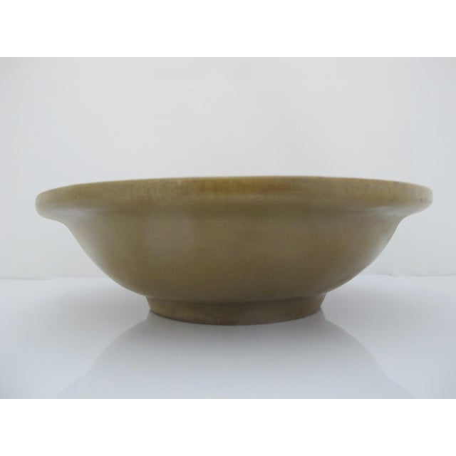 Antique green-glazed ceramic vessel resembling historic Yue-ware or early celadon bowl styles, featuring an olive-toned...
