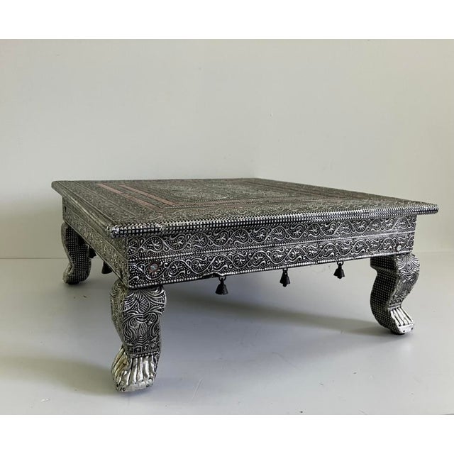 This vintage Indian pooja table, dating from the mid-20th century (circa 1960s–1970s), is crafted with embossed metal over...