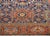 An incredible early 20th century Persian Karaje Serapi rug with a field of all-over large-scale stylized flowers amidst a...