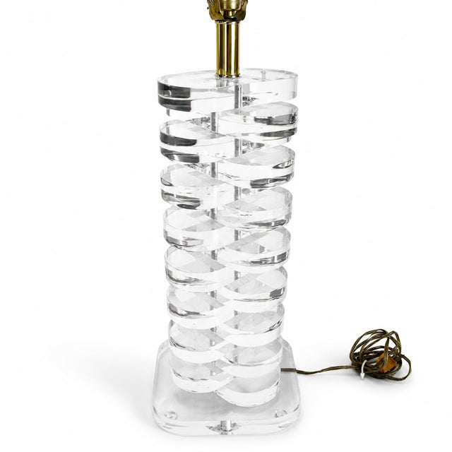1970s vintage lucite table lamp. This piece has thick, multi stacked lucite blocks. Perfect piece to add a touch of the...
