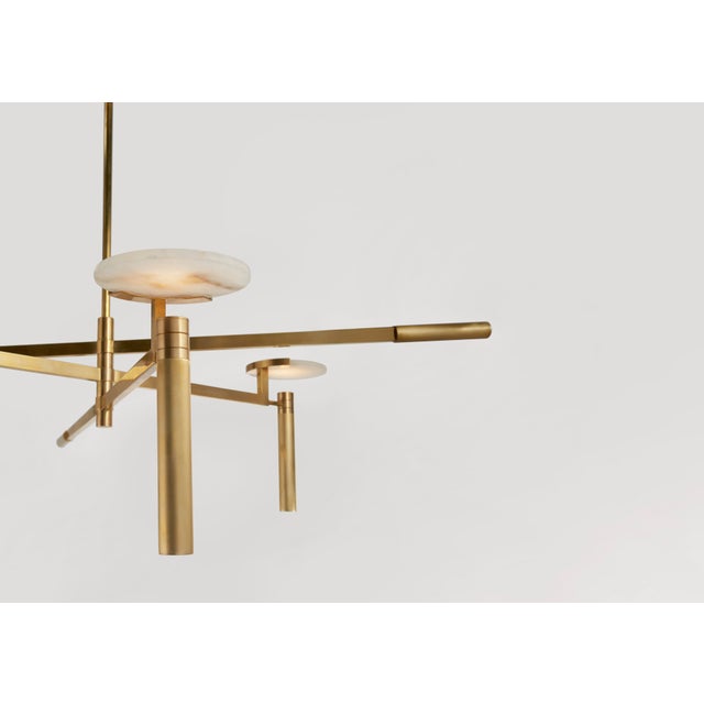 Melange Large Floating Disc Chandelier in Antique-Burnished Brass with Alabaster Designer: Kelly Wearstler Fixture Height:...