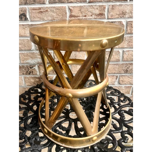 Mid Century Sarreid style stool, brass with X design sides. Perfect for a modern home.