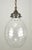 Mid Century pressed glass pendant light. The egg shaped shade features geometric patterns, including a chevron design...