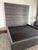 This is a custom-made California King bed frame, commissioned specifically for a private residence and crafted with...
