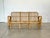 1970s rattan and bamboo sofa, fabric-lined cushions.