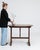 A 19th century French wine tasting table crafted in oak, designed with a folding mechanism for practical use. The circular...