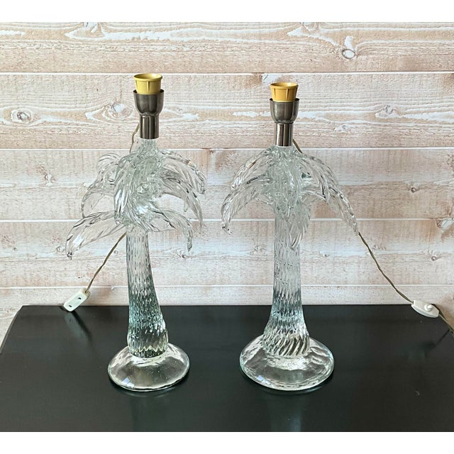 Exceptional pair of sculptural vintage table lamps in massive textured clear glass, designed as stylized palm trees....