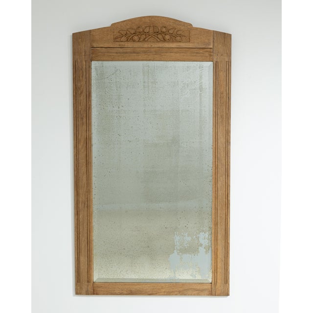 A large-scale French Art Nouveau mirror dating to circa 1910, crafted in wood and designed with a strong vertical...