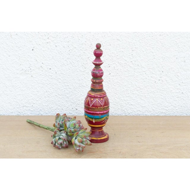 A festive example of traditional Indian folk art, this slender wooden vessel is crafted using "lac-turnery." In this...