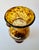 Large hand-blown art glass vase with a luminous amber and dark brown tortoiseshell pattern. The tall amphora form has a...