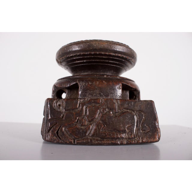 Traditional seeder used in Eastern India to sow the land more evenly than by hand. Each side is engraved with syncretic...