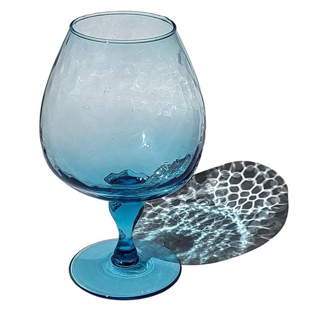 Offered is a vintage Empoli turquoise blue hand-blown glass pedestal vase with optic swirl texture. Measures 9" tall, 6"...