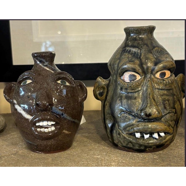 Four face jugs in one package. Four folk artists that should be in your collection. The first face jug is by Joe Reinhart...