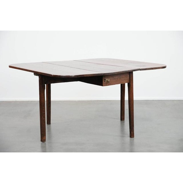 Charming antique English oak lop-legged dining table from the late 19th century. : This beautiful and charming antique oak...