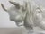 This is a pottery blanc de chin Sculpture of a bull. this dynamic sculpture of a bull is in a cream color glaze and the...