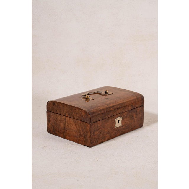 English burl wood sewing box with a brass top handle, book-matched veneer, fitted interior, and original hardware. Rich...