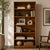 Vintage Danish Modern Teak Bookcase With Adjustable Shelves. A tall vintage teak bookcase with clean lines, six open...