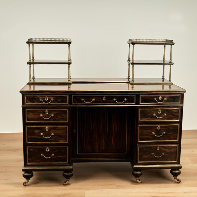 Rare and important early 19th Century desk handcrafted in calamander wood featuring two organizers on the banded top with...