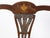 An English mahogany child's chair from the 19th century, with feather motifs and marquetry décor. Created in England...