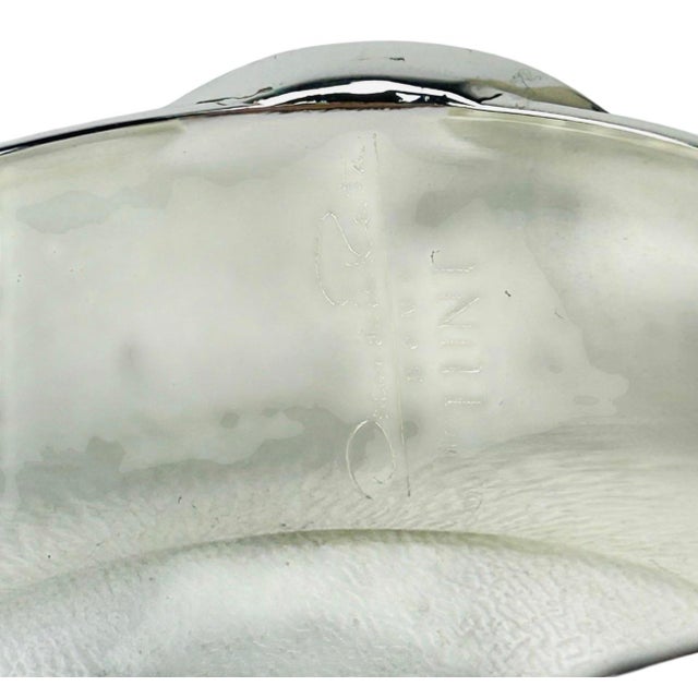 Grouping of eight wide silverplated metal cuff bangle bracelet style napkin ring holders. Each features an oval black...