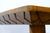A sculptural solid wood game table by Brazilian architect and designer José Zanine Caldas. The rectangular top features a...