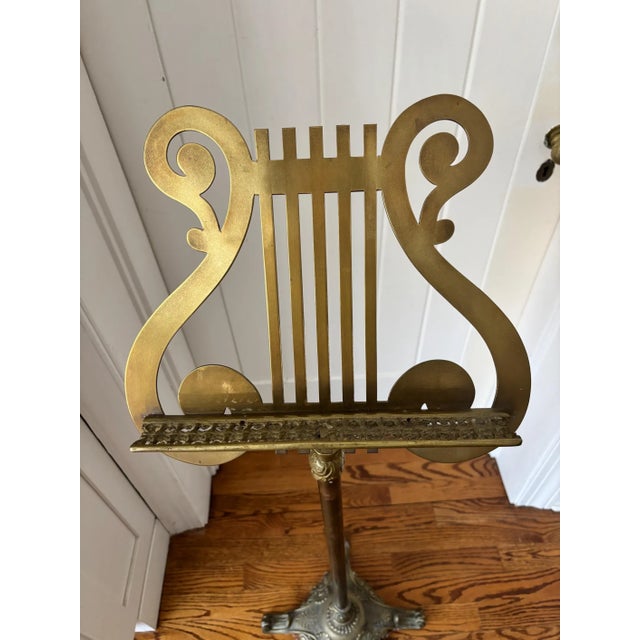 Proudly display your music score or a special book on this vintage brass music stand with lyre motif. Intricate carved...