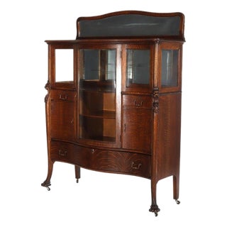 1900-1909 Attributed to Rj Horner Figural Carved Oak Server, Griffins & Full Serpentine Glass For Sale