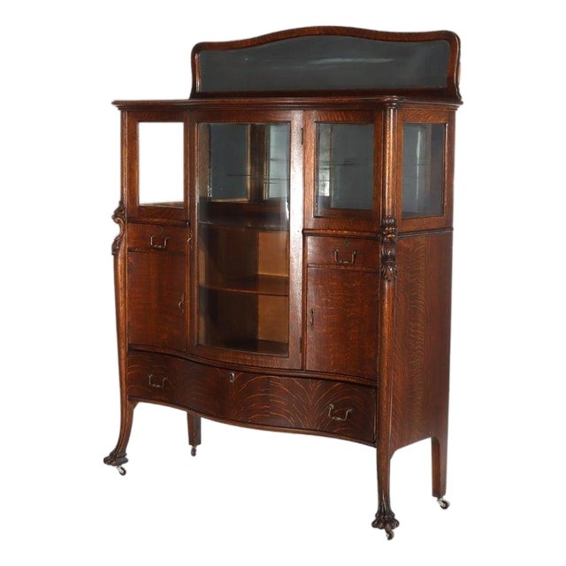 1900-1909 Attributed to Rj Horner Figural Carved Oak Server, Griffins & Full Serpentine Glass For Sale