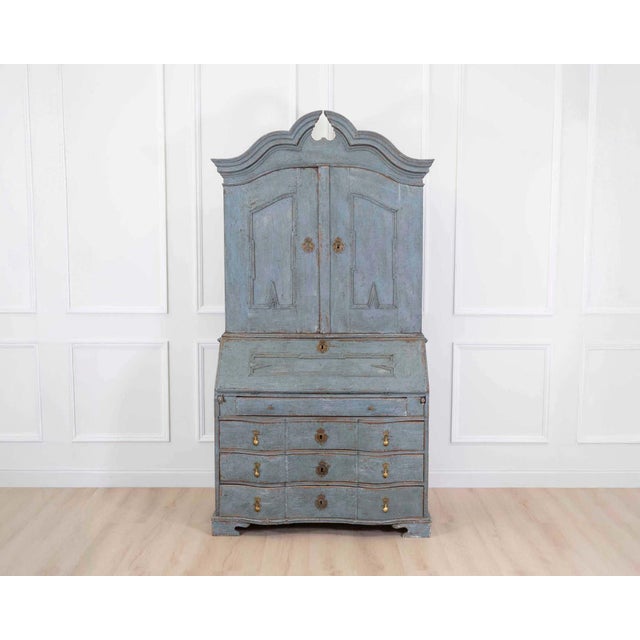 Made in Scandinavia in the eighteenth century, this bureau is fitted with unusual and rare hardware. The bureau, a...