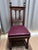 Solid wood dining chairs, beautifully detailed. Seats are upholstered in deep burgundy leather accented with original...