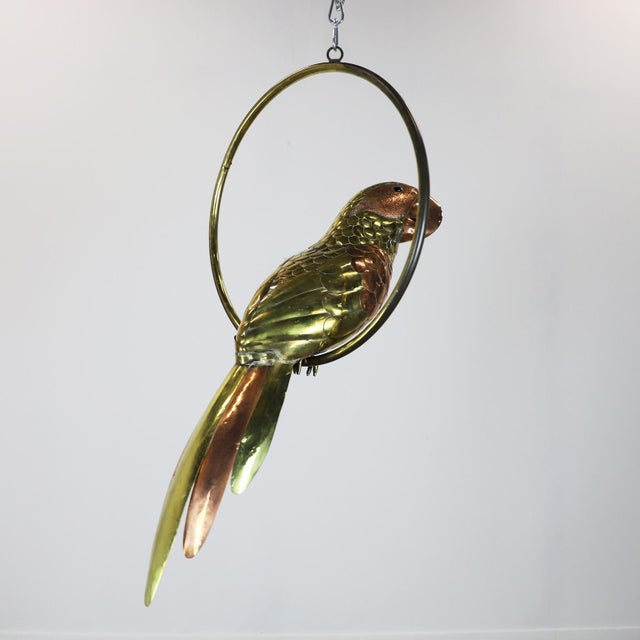 We offer this macaw sculpture by Mexican artist Sergio Bustamante, circa 1960 made in brass and copper with fantastic...