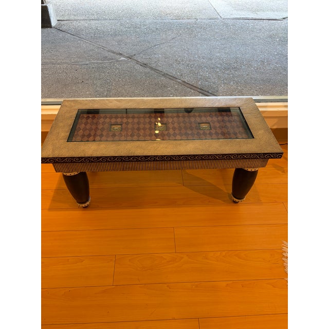 A whimsical postmodern coffee table by Fabian Garcia, created in 1997. The hand-painted wood base features a graphic...