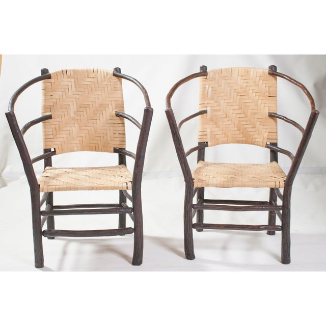 Vintage Pair of Old Hickory Barrel Chair Style Andrew Jackson crafted from rustic bent hickory saplings with a woven wood-...