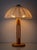 A sculptural Scandinavian pine table lamp from the 1960s-1970s featuring an open architectural frame base and a wide...