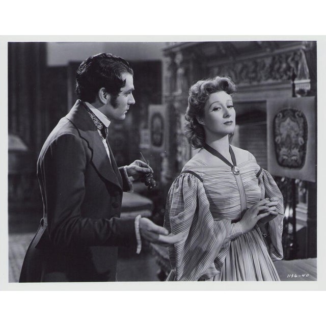 Original black-and-white lobby card for the film "Pride and Prejudice" (1940) featuring Greer Garson and Laurence Olivier....