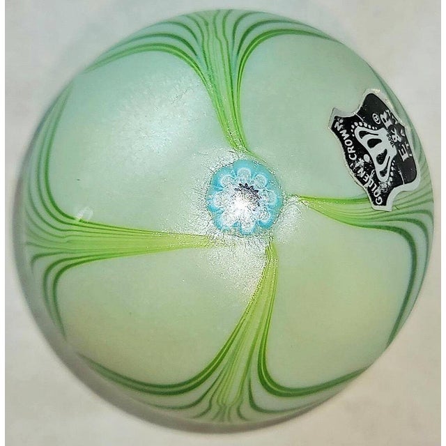 Like a key lime pie, this vintage Golden Crown E&R Italy art glass paperweight features a white, frosted background with a...